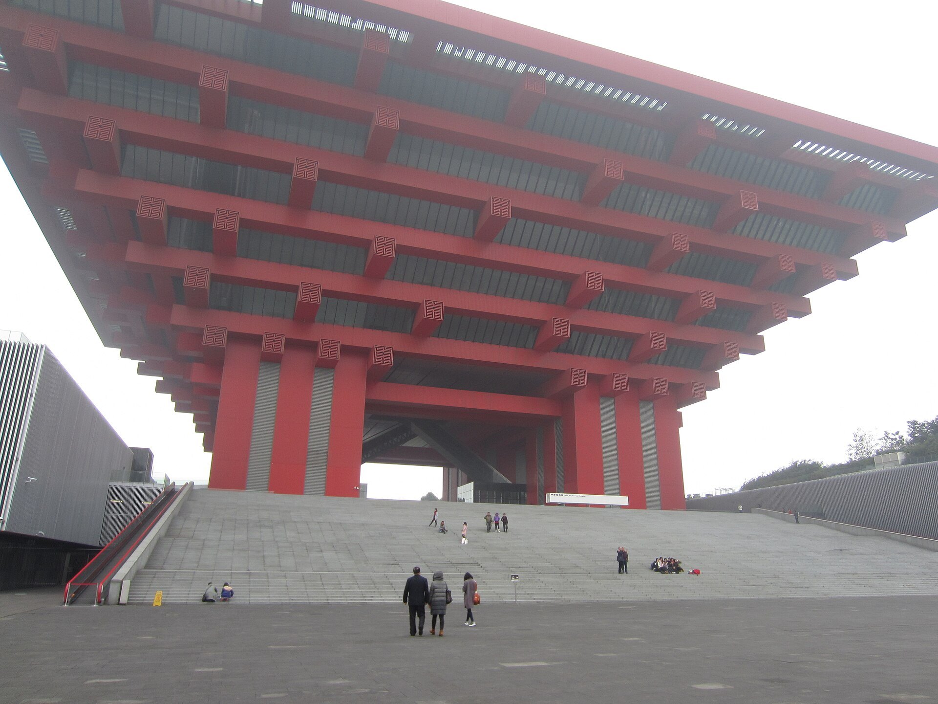 Looking up into the underside of the museum's cantilevered red structure