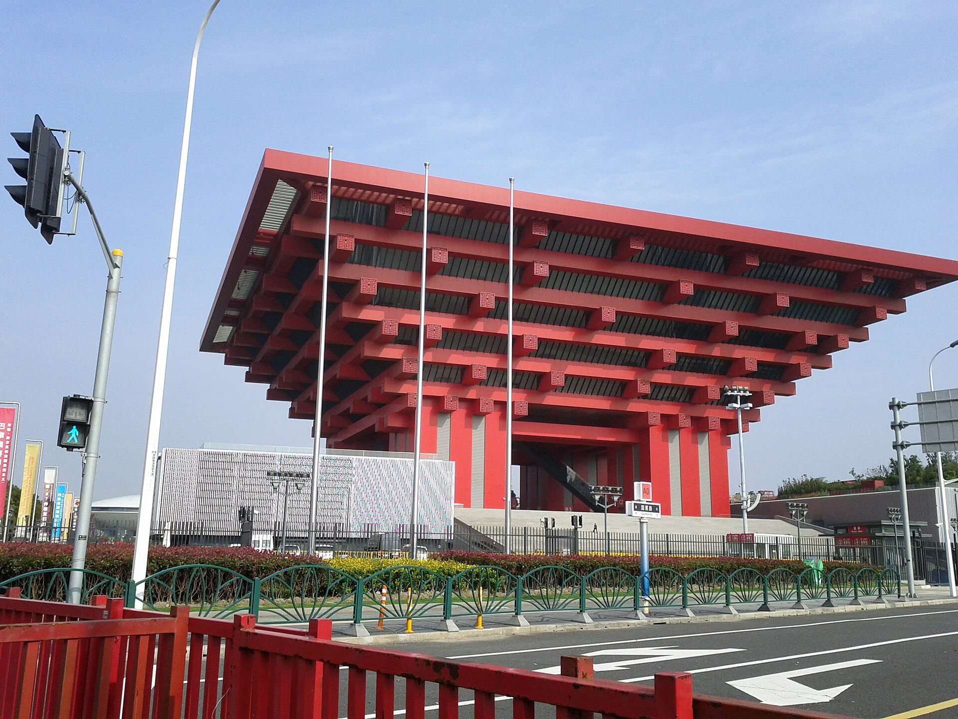 The museum seen from the street with traffic passing in front