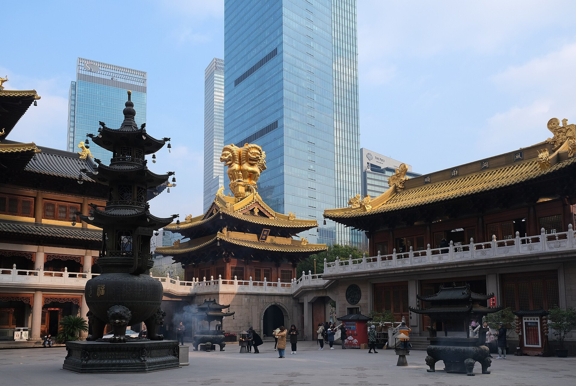 The gilded roofs of Jing'an Temple directly beneath the office towers around it