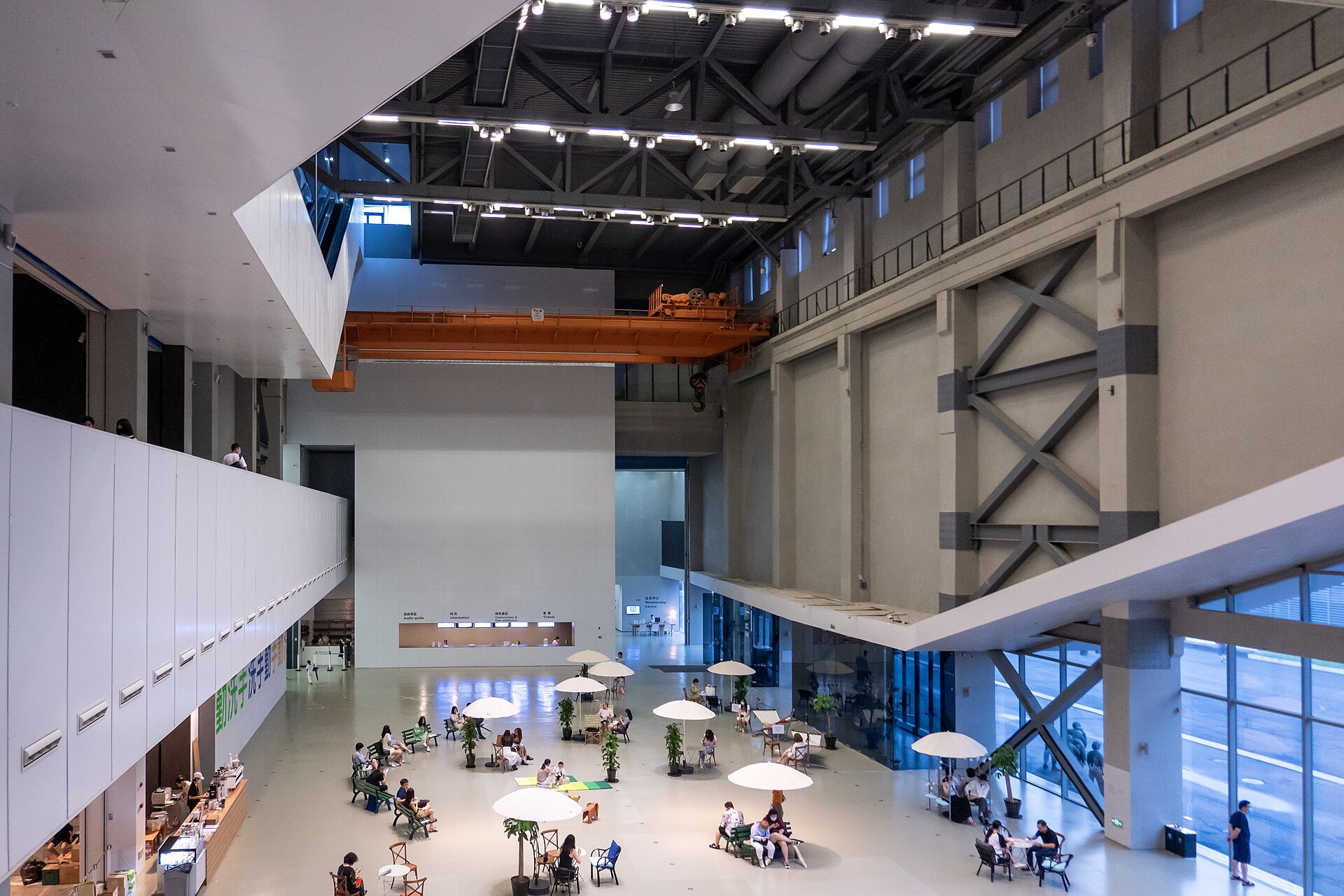 The open interior of the turbine hall, now gallery space, with visitors