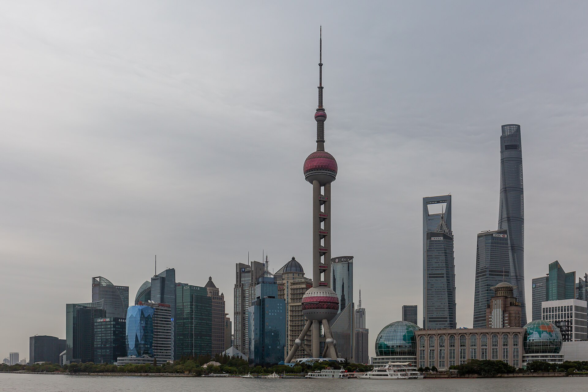 A wide panorama of the Pudong skyline from across the water