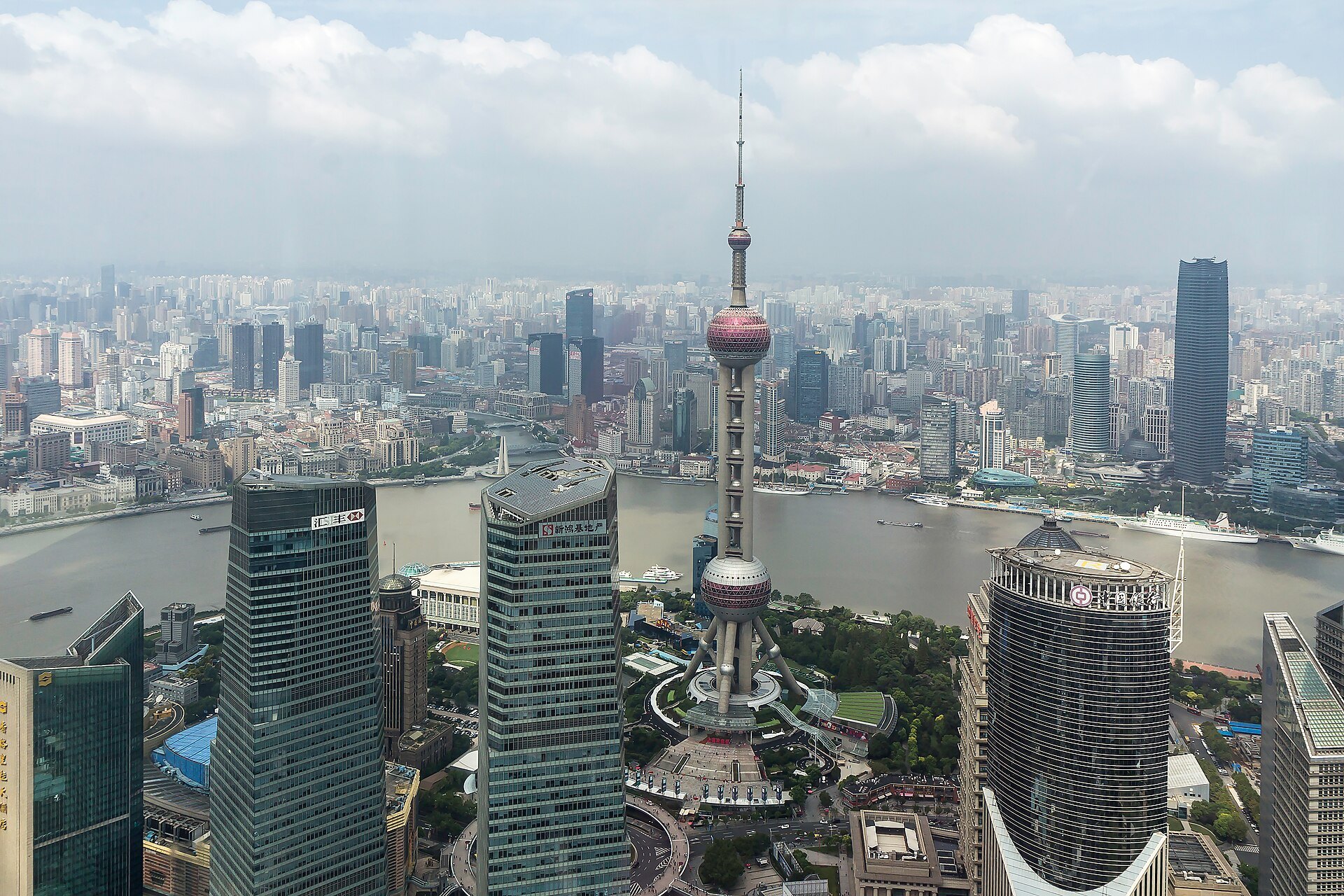Lujiazui seen from the Bund, with barges working the river in front