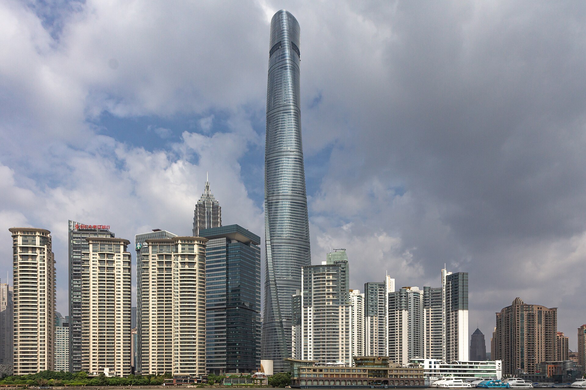An aerial view over Pudong with the river curving through it