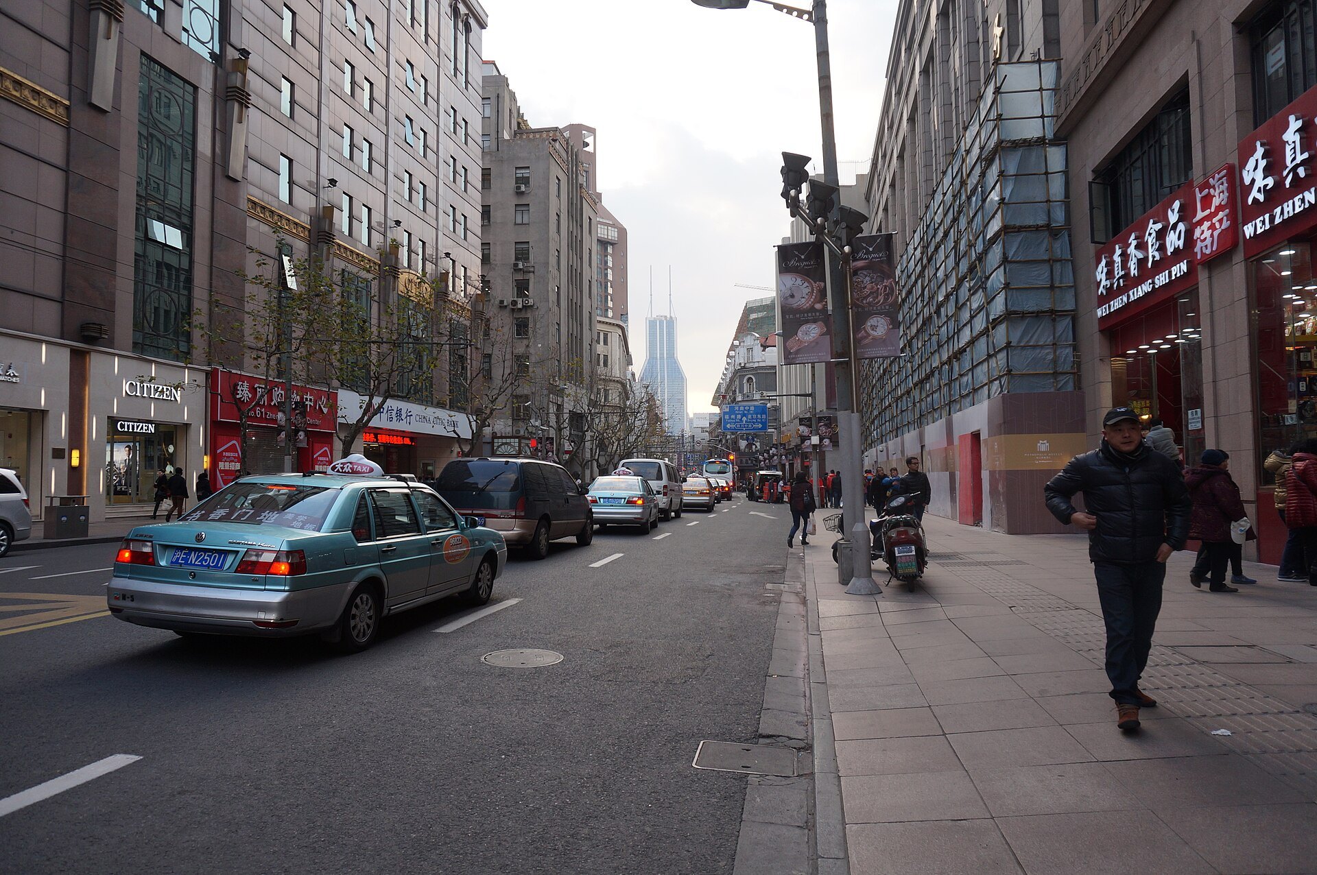 East Nanjing Road with traffic and shopfronts along both sides