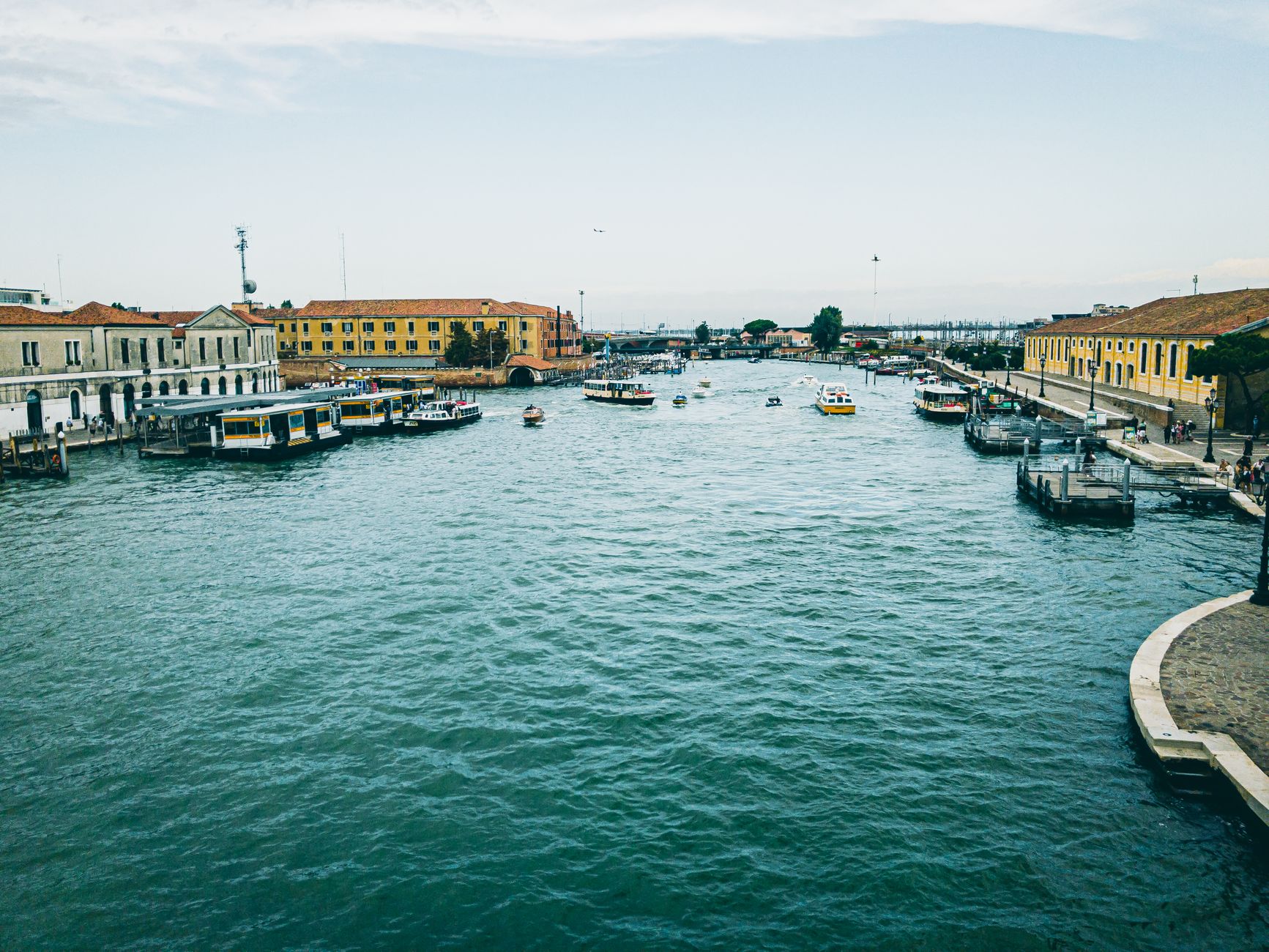 Canal view in Venice, showcasing historic architecture and watercrafts in a urban setting