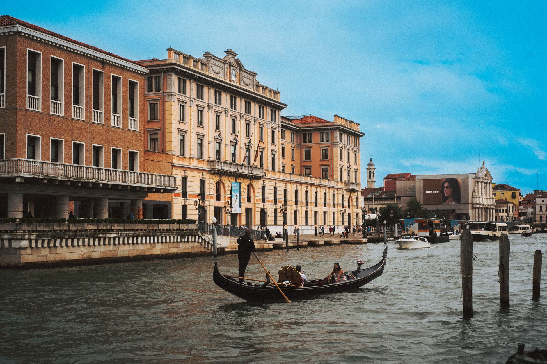 Gondola on Venice's Grand Canal with historic architecture in the background