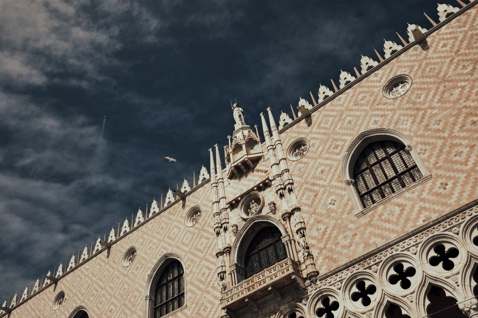 Gothic facade of Doge's Palace in Venice, Italy under a sky