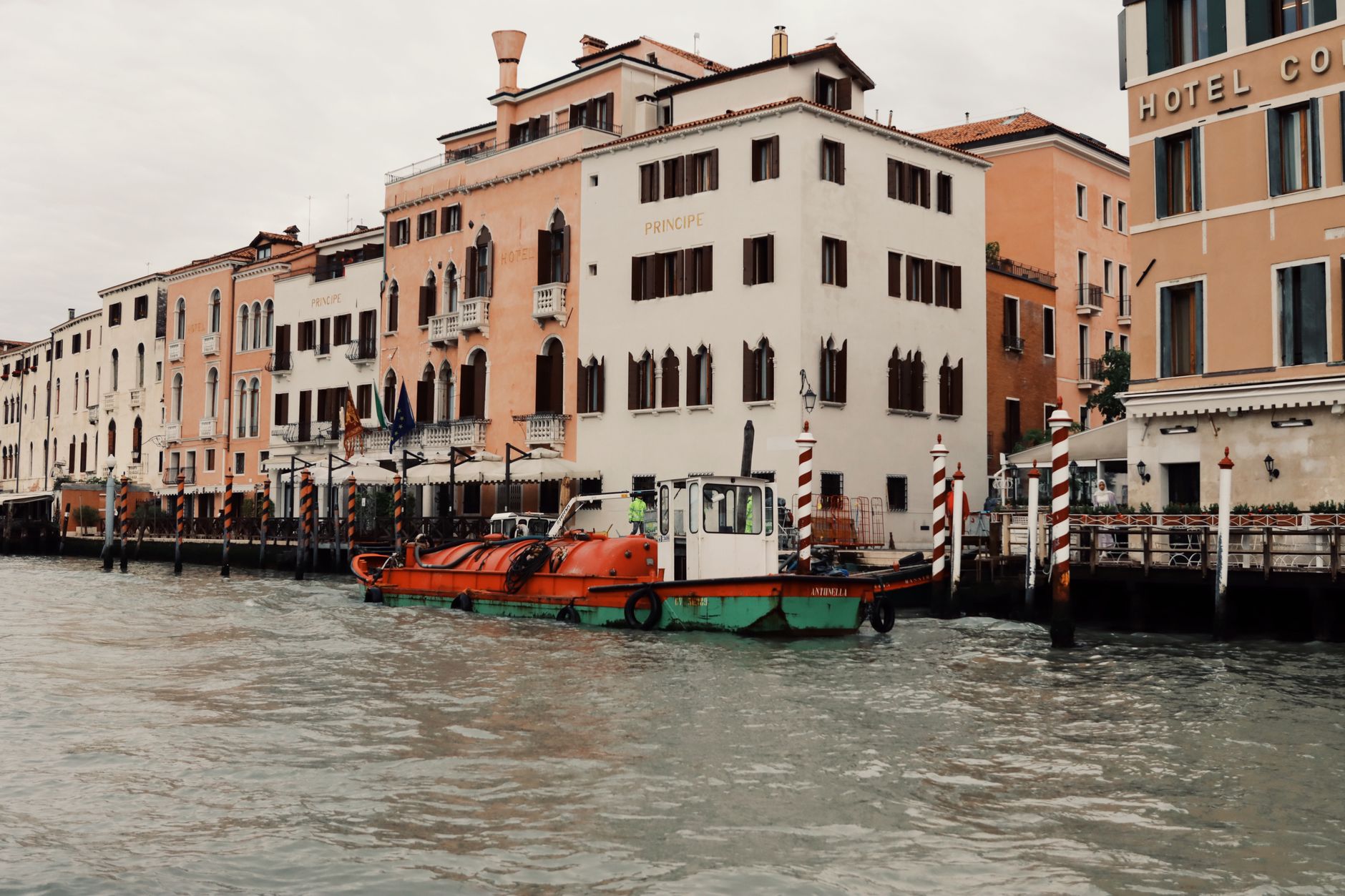Canal in Venice, Italy, with historic buildings and a boat on the water