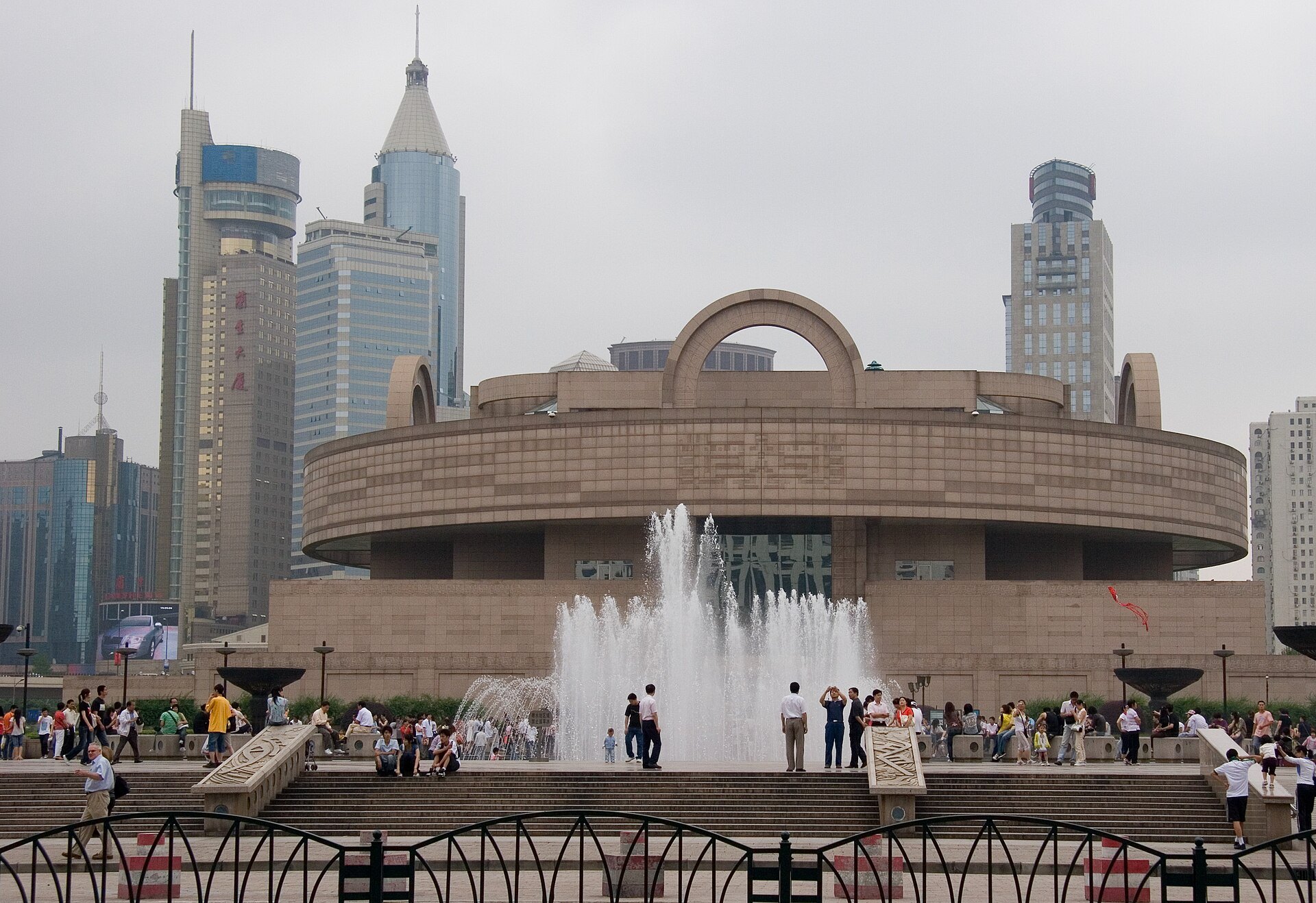 The fountain on People's Square with the museum building behind it
